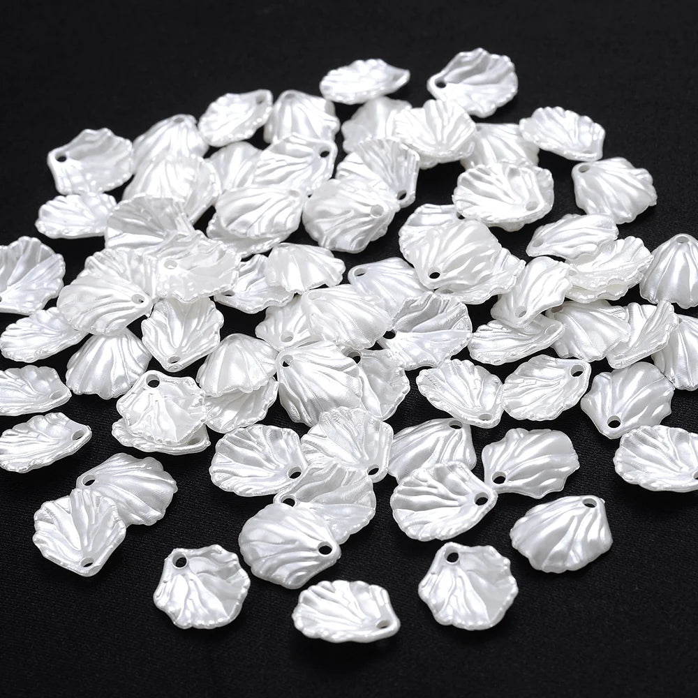 A pile of 100 clear acrylic pearl spacer beads for jewelry making