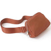 A brown nylon waist pack with a zippered pocket and adjustable strap.