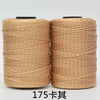Spool of tan 3-ply polyester knitting yarn for crochet and hand crafts