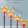 A set of four adjustable kids' basketball hoops featuring cartoon tiger designs, demonstrating various height options.