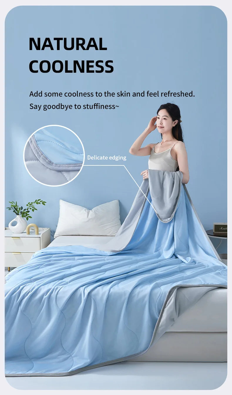 A woman is shown relaxing under a light blue cooling quilt on a bed, emphasizing natural coolness and refreshment.