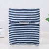 A navy and white striped fabric shopping bag with a rectangular tag labeled BAGCU