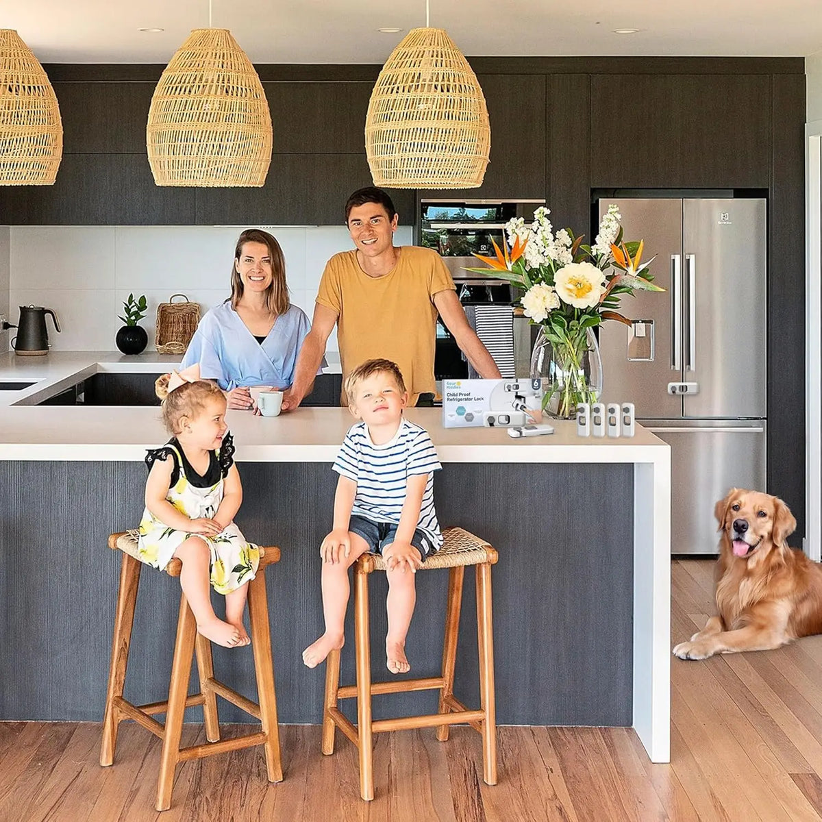 A family is gathered around a kitchen island with a refrigerator, featuring child safety locks.