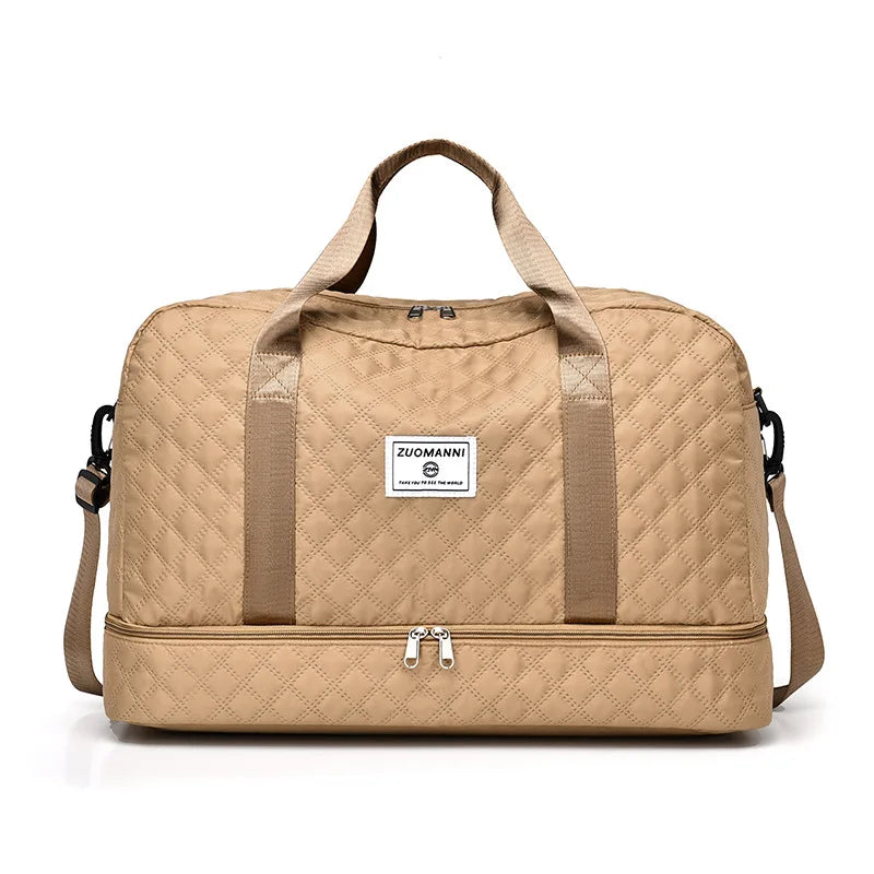 A beige lightweight nylon travel duffle bag with tan straps and a square label on the front.