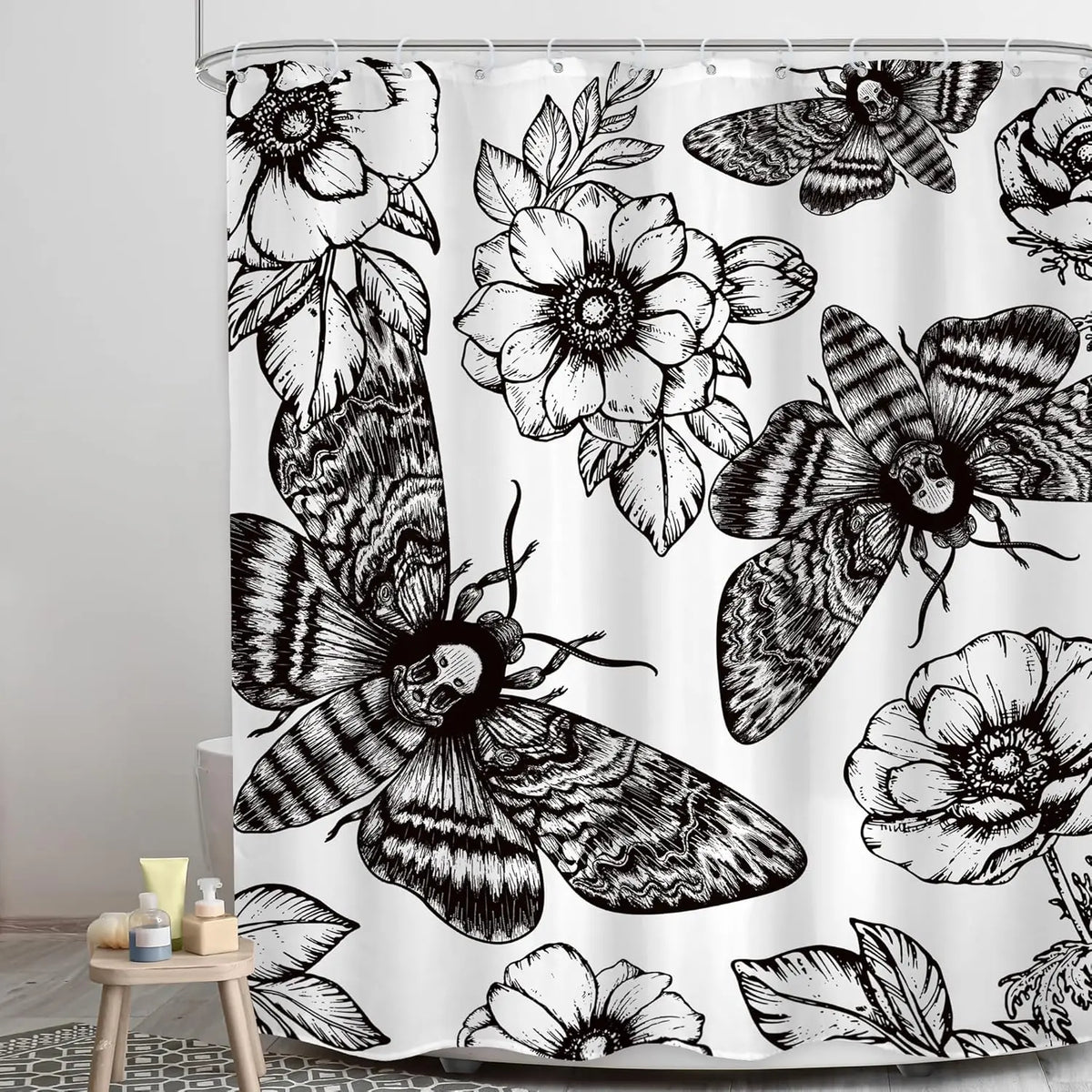Black and white gothic skull shower curtain featuring detailed moth and floral patterns