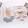 A collection of six-layer muslin cotton baby bibs and burp cloths in various pastel colors with adjustable snap closures.