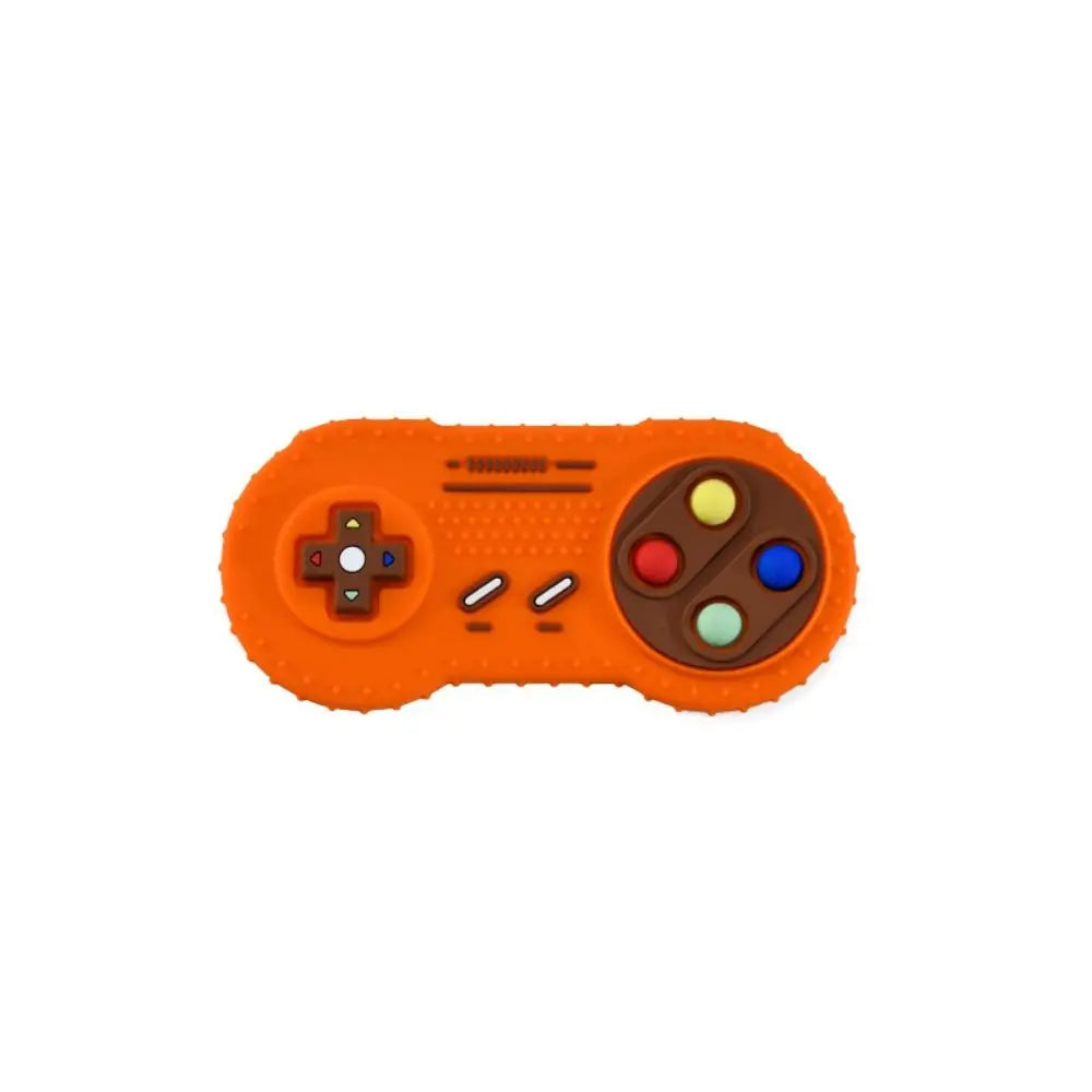 An orange silicone teether toy shaped like a remote control with buttons and a joystick.