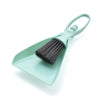 A light mint green compact mini broom and dustpan set for cleaning desks and keyboards.