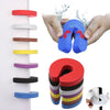 Hands demonstrate the foam door stopper, showing its shape and finger pinch protection features.