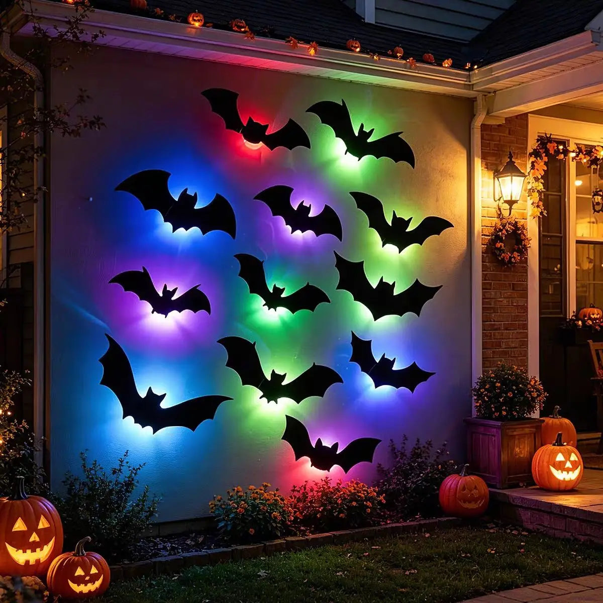 A wall decorated with glowing black bat silhouettes illuminated by multi-colored LED lights for Halloween