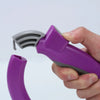 A hand holds a purple ergonomic grocery bag carrier with a gray handle, showing the device's design.
