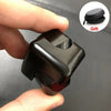A hand holds a black alloy metal fidget cube spinner, showing its design and texture.