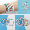 A collection of colorful acrylic alphabet letter beads and wire for jewelry making projects.