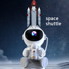 A white astronaut figure is positioned in front of a space shuttle model against a dark, starry background.