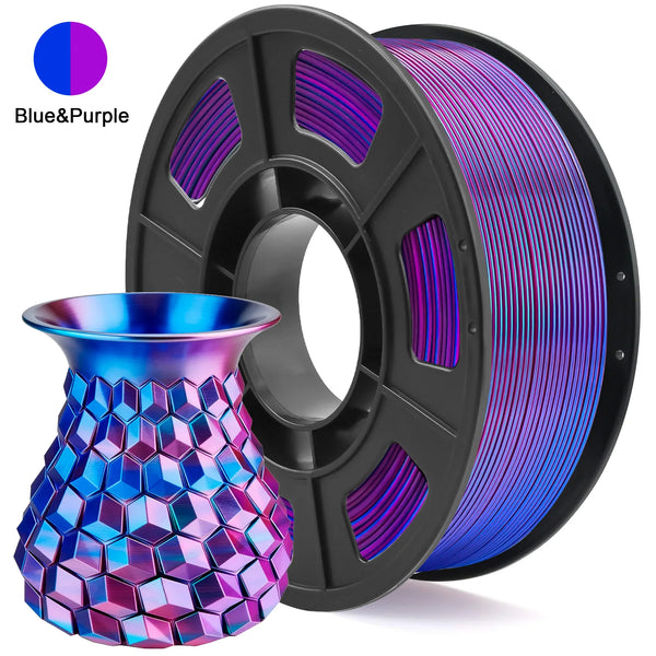 A black spool of blue and purple filament next to a hexagonal glass-like vase.