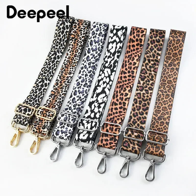 A set of leopard print wide adjustable crossbody bag straps in various shades of brown and black.