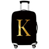 Black rolling suitcase with a gold letter K print on the side.