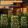 Solar powered willow tree fireworks lamp illuminating a garden with warm LED lights
