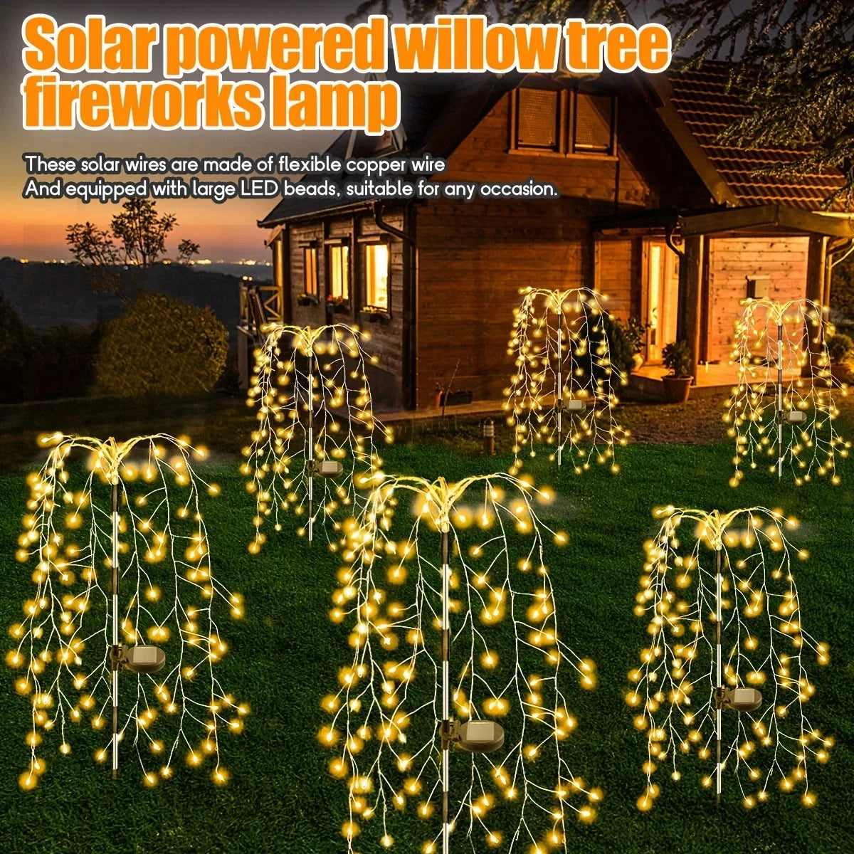 Solar powered willow tree fireworks lamp illuminating a garden with warm LED lights