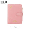 A pink leather wallet featuring an airplane pattern and RFID protection.