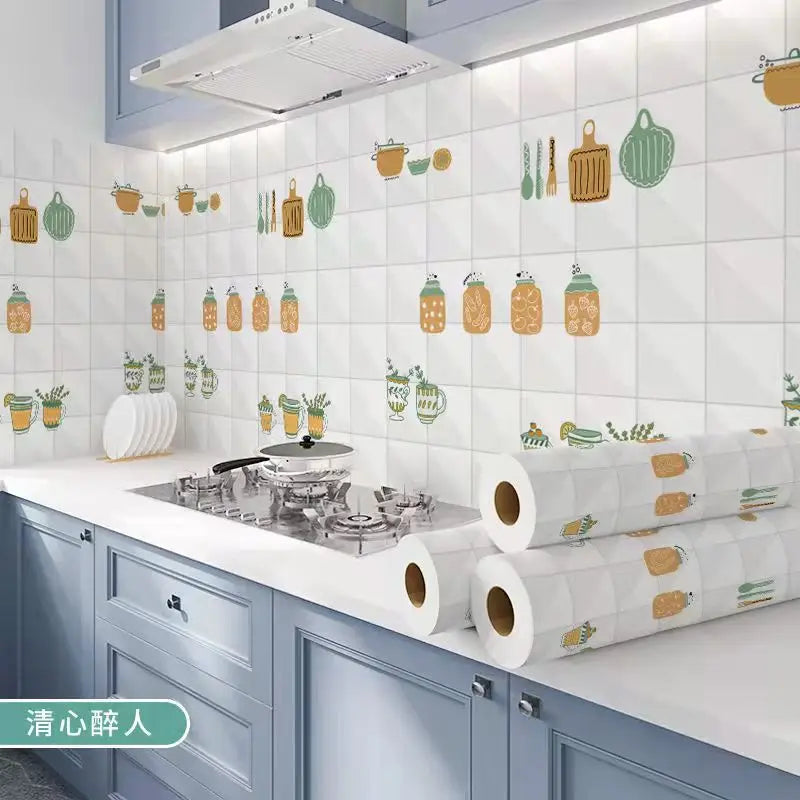 A kitchen splashback featuring decorative green and orange ceramic-style stickers on a white tile background.