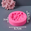 Pink silicone molds shaped like frangipani gardenia flowers for candle and soap making