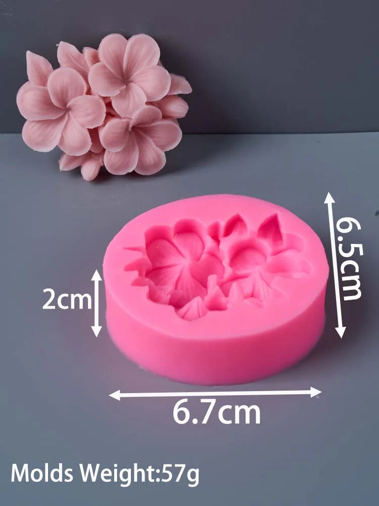 Pink silicone molds shaped like frangipani gardenia flowers for candle and soap making