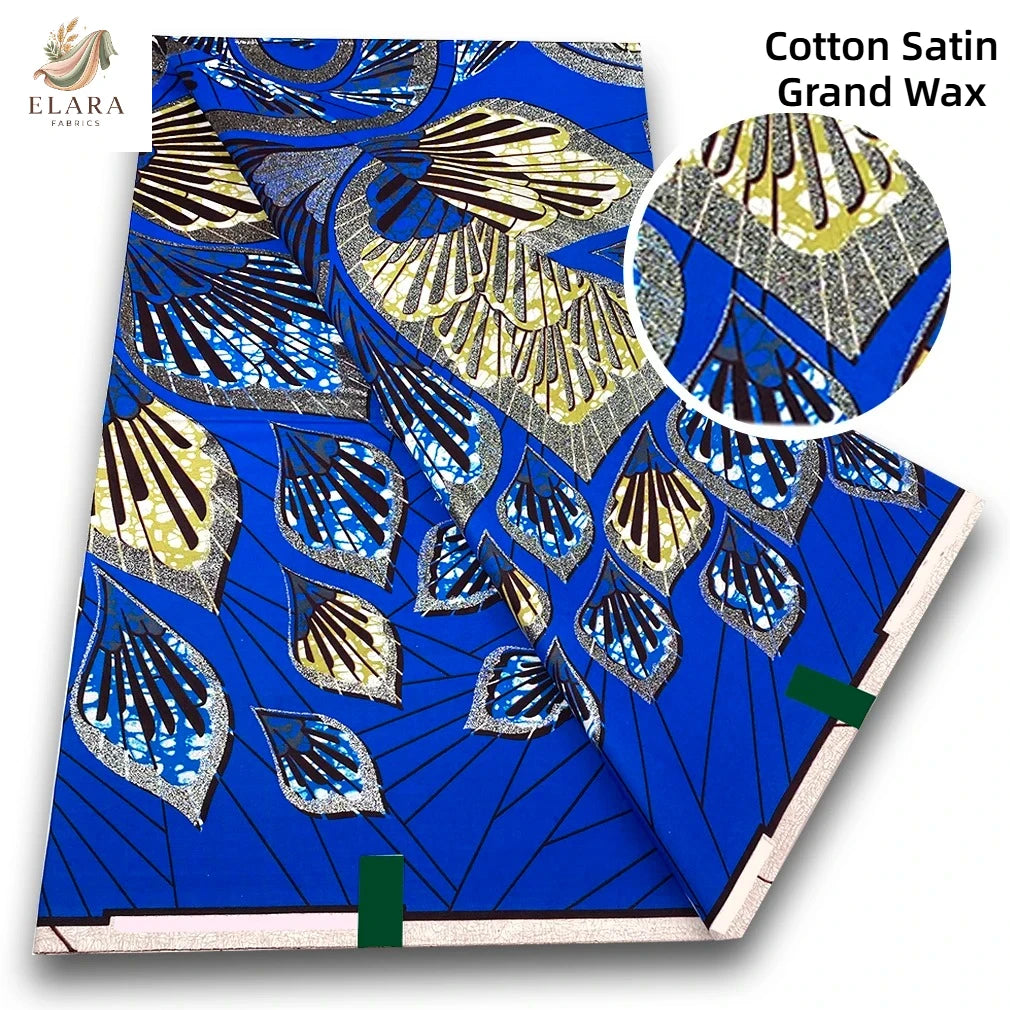 Blue and gold cotton satin grand wax fabric featuring intricate geometric patterns