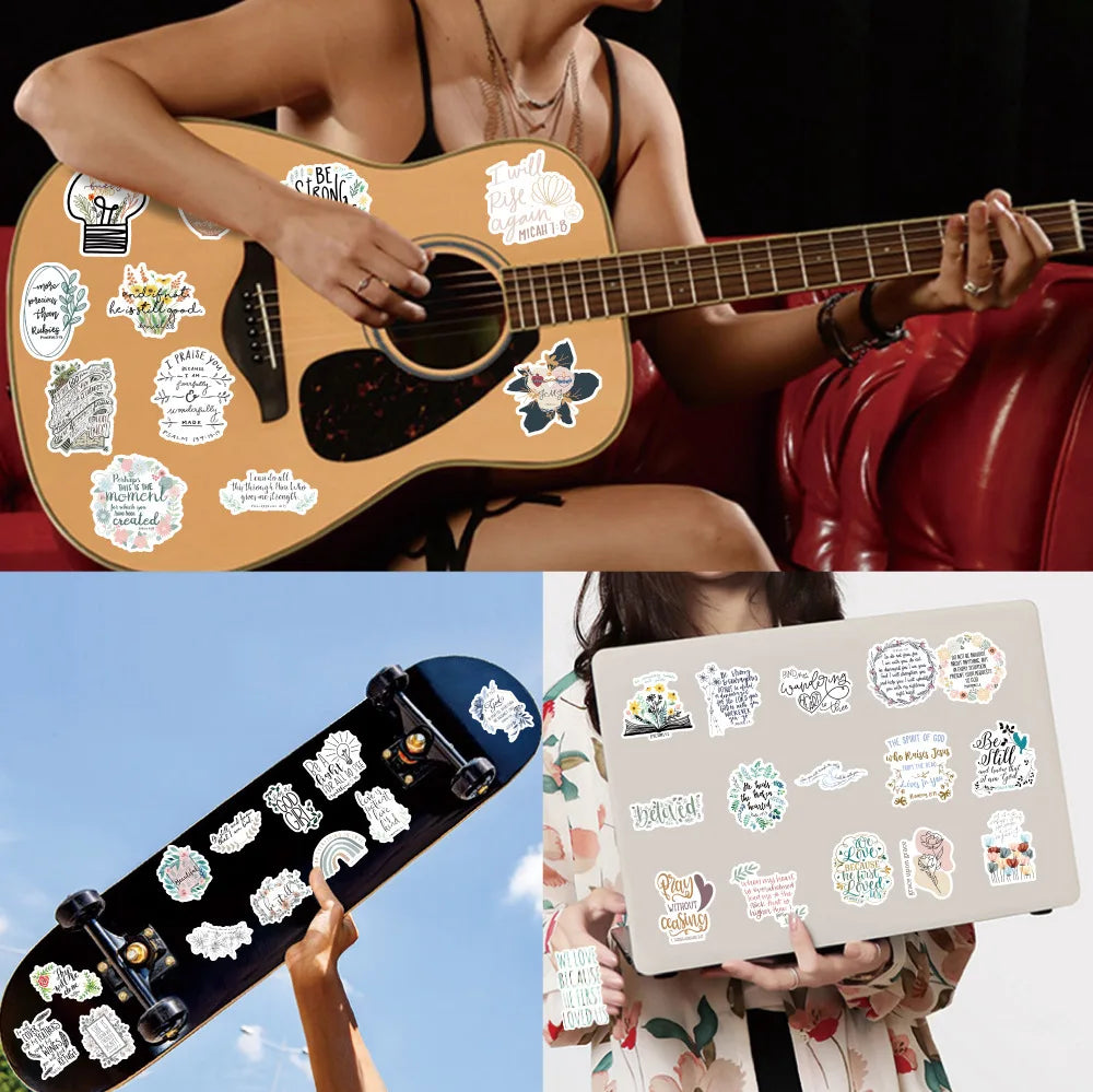 A person holds a guitar decorated with inspirational Bible verse stickers and a laptop decorated with similar stickers.
