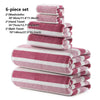 A six-piece set of pink and white striped bath towels including washcloths and bath towels