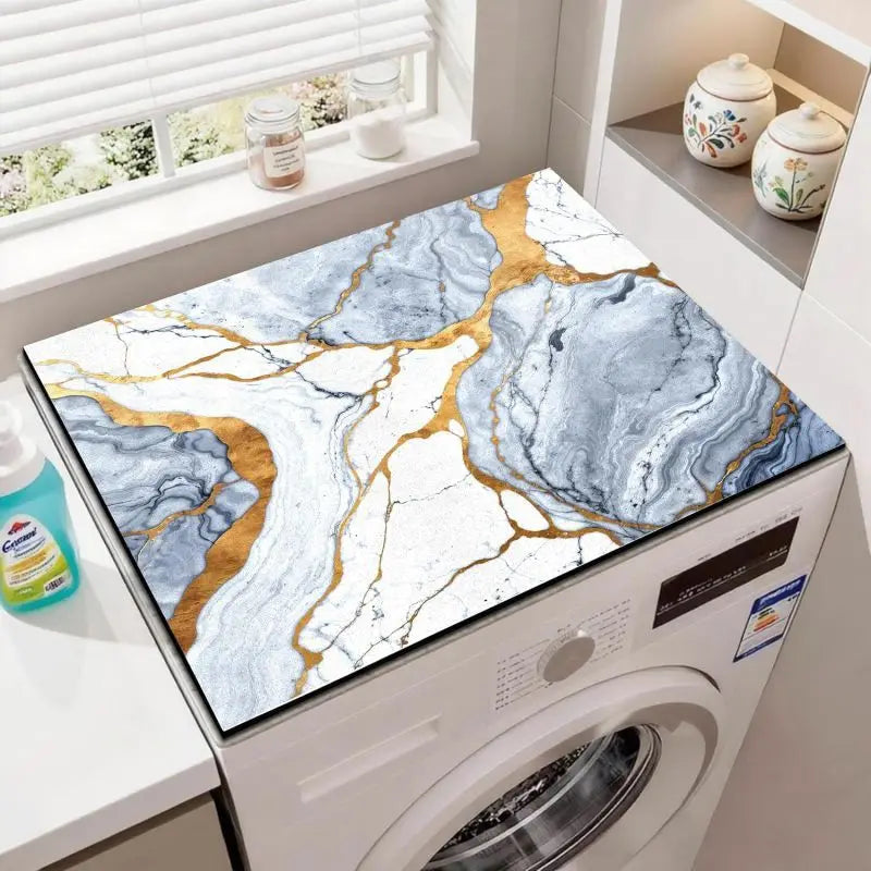 A wood grain waterproof washer and dryer mat featuring marbled blue and white stone with gold veining.