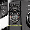 Close-up of a black metal push-start ignition button cover with a start engine stop mechanism and an inner diameter measureme