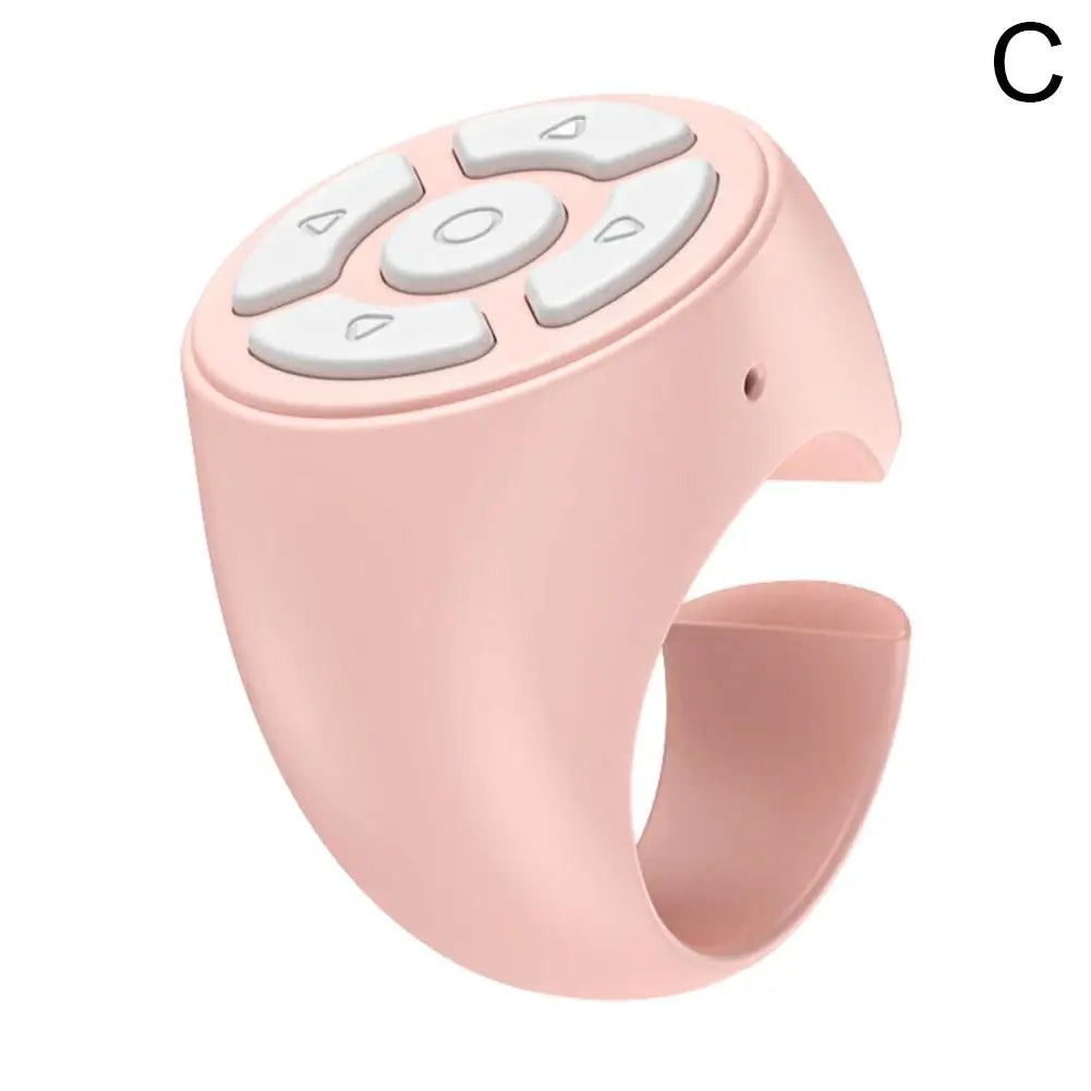 A pink Bluetooth ring remote control with multiple buttons and a flexible band.