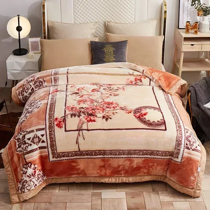 A beige weighted plush blanket with a floral pattern is displayed on a bed, next to a wooden nightstand.