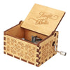 A wooden music box with a hinged lid and decorative carvings, featuring the title Tingle Bells.