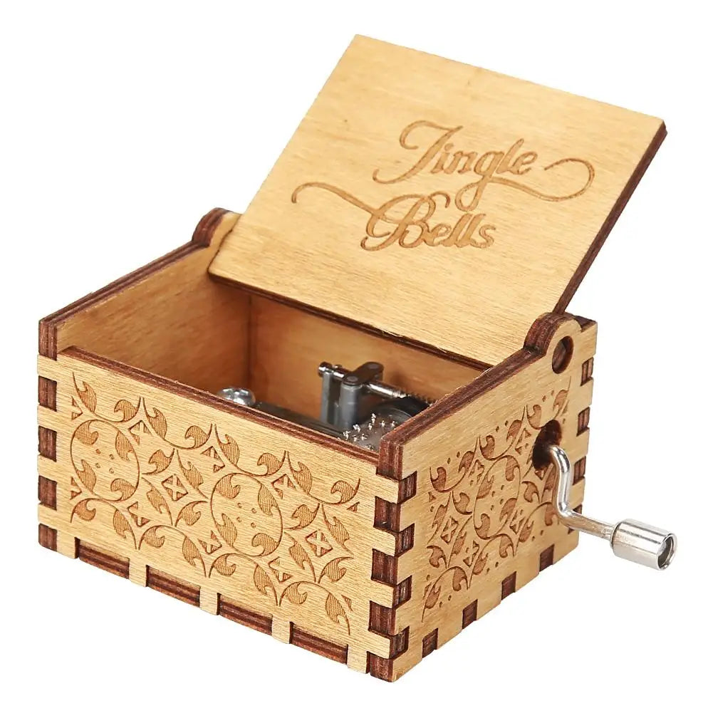 A wooden music box with a hinged lid and decorative carvings, featuring the title Tingle Bells.