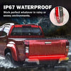 A red pickup truck with an illuminated light bar is shown in a rainy or snowy environment.