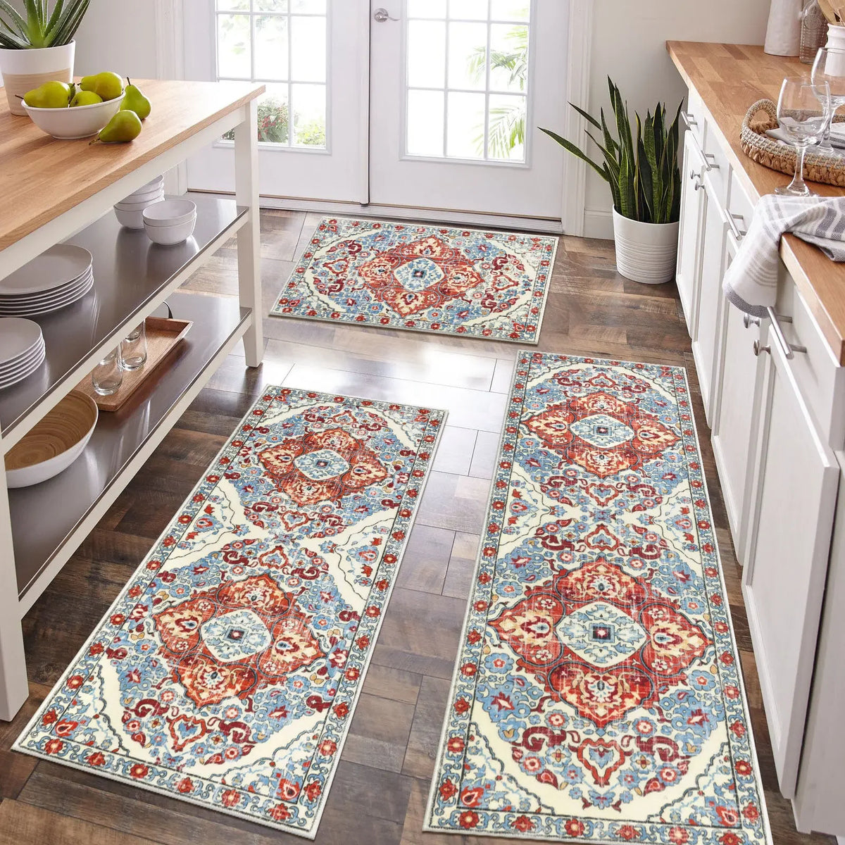 A long rectangular bohemian non-slip kitchen rug featuring intricate floral patterns in blue, red, and cream on a wood floor.