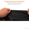 A hand is stretching a sheet of black faux leather material to demonstrate its elasticity and durability.