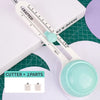 A white adjustable circular paper cutter with a clear measuring scale and two interchangeable blades is shown on a green cutt