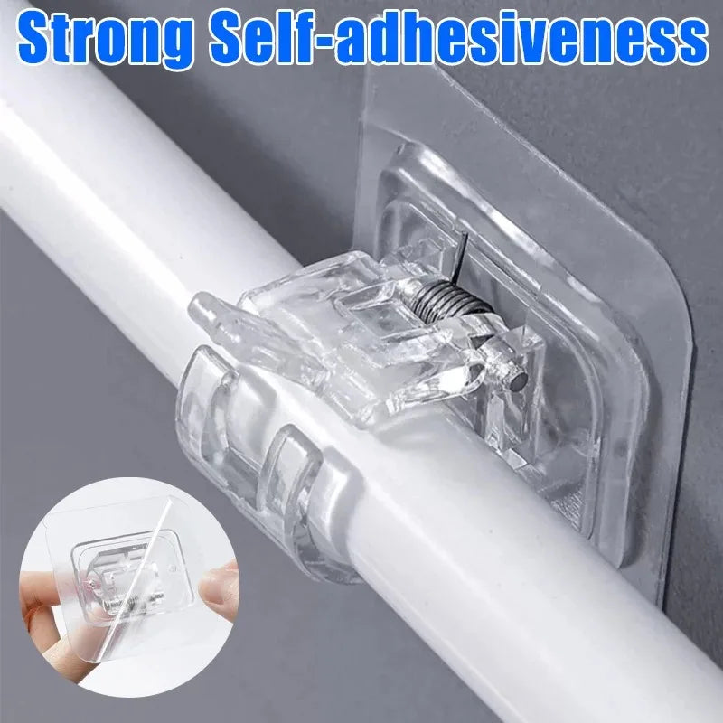 Close-up of a clear adhesive hook clamp attached to a white pole, demonstrating strong self-adhesiveness.