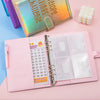 Pink A5 budget binder with clear pockets for cash envelopes and a savings challenge