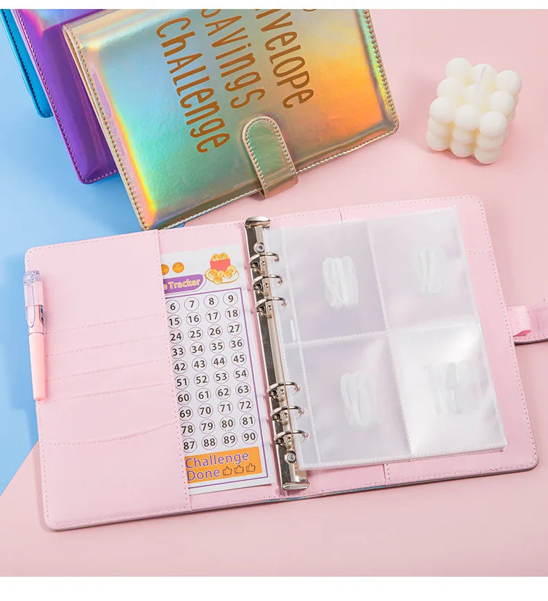 Pink A5 budget binder with clear pockets for cash envelopes and a savings challenge