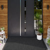 A dark gray modern door with vertical glass panels and a black non-slip doormat in front of it.