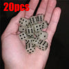 A hand holds a set of 20 glow-in-the-dark acrylic dice for night games.