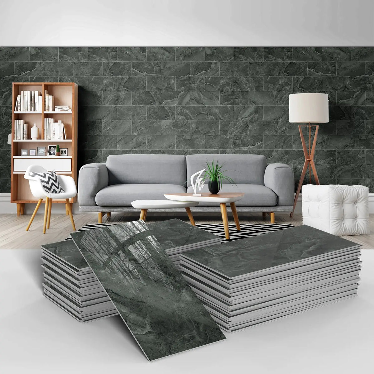 Stacks of dark gray marble self-adhesive wall stickers used as 3D tile decals in a modern room setting.