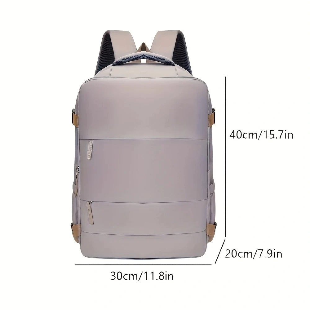 A light gray expandable carry-on travel backpack shown from the back with measurements.