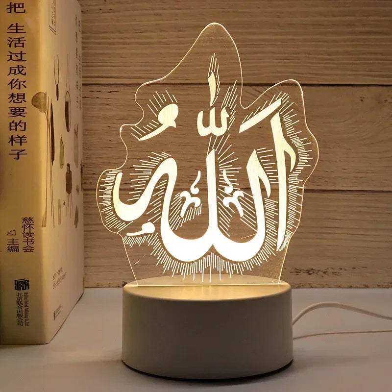 A translucent acrylic LED night light featuring the Arabic calligraphy of Allah and Muhammad on a circular base.