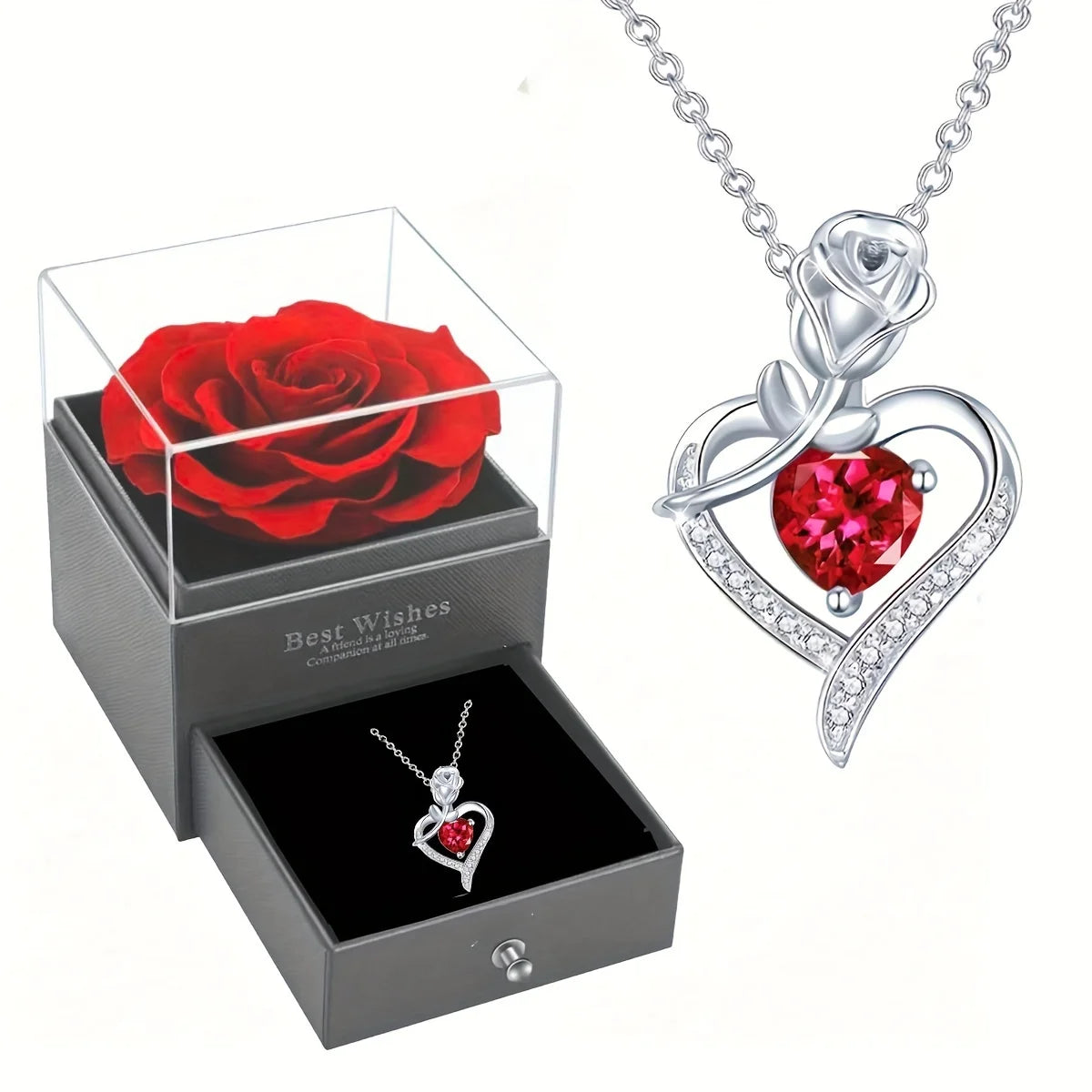 A presentation box containing a red rose and a silver heart pendant necklace with a red gemstone.