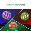 A hand is holding a colorful, glowing LED flying ball that spins in 360 degrees.